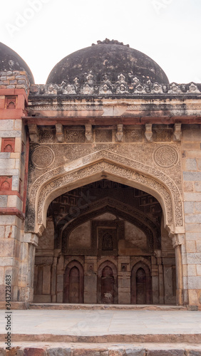a bara gumbad mosque arch at lodhi gardens in new delhi