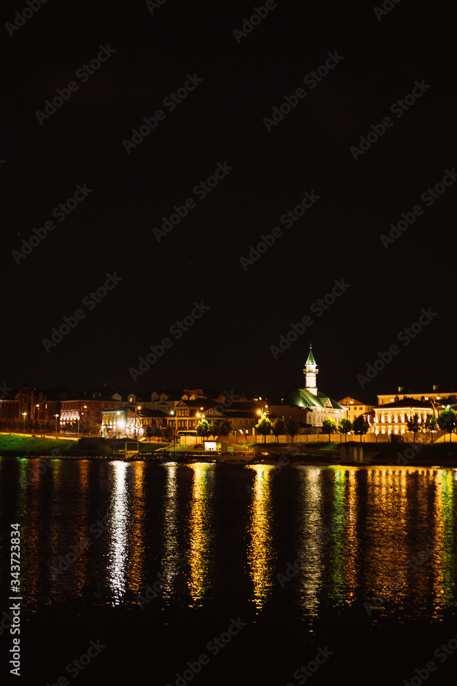 Russia. Kazan. August, 2019. Summer. City center. Light from buildings is reflected in the water.