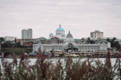 Russia. Kazan. August, 2019. Summer. View of the river and the city center. Russian cityscape with a church and ancient buildings. View of the Kremlin.