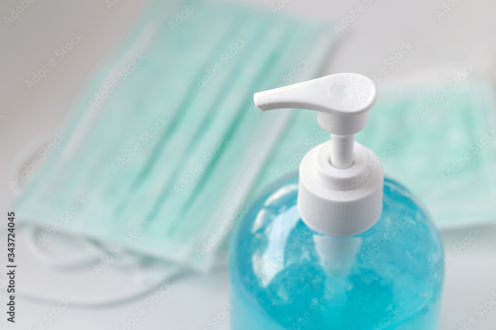 medical surgical masks and hand sanitizer gel for hand hygiene, health care concept.Coronavirus disease (COVID-19) medical surgical masks and hand sanitizer gel for hand hygiene, health care concept.Coronavirus disease (COVID-19)