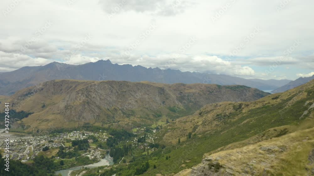 Southern Alps Mountains Looming in the Distance on Cloudy Afternoon, Aerial Southern Alps Mountains Looming in the Distance on Cloudy Afternoon, Aerial