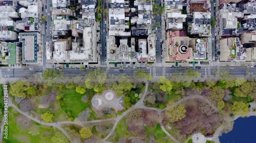 Aerial, top down, drone shot above a street at the central park, empty due to COVID-19, cloudy, spring day, in Manhattan, New York city, USA