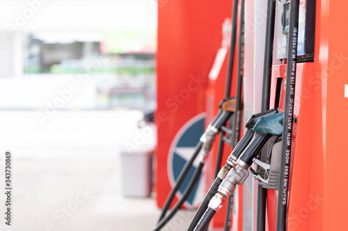 Close-up hands refueling in car,The petrol station staff is refilling the car for customers,Refill fuel in car at gas station,Focus hands refilling.