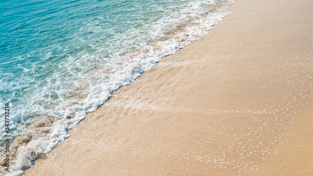 wave of blue ocean on sandy beach. texture Background. wave of blue ocean on sandy beach. texture Background.