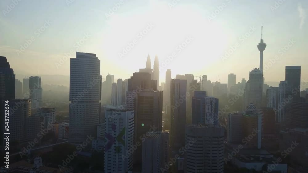Kuala Lumpur skyline aerial view at sunset with Petronas Towers and other skyscrapers. (Malaysia.) Kuala Lumpur skyline aerial view at sunset with Petronas Towers and other skyscrapers. (Malaysia.)