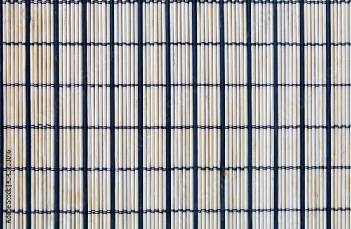 Bamboo texture closeup. Wallpaper with black lines in the form of rectangles. Pattern for design.