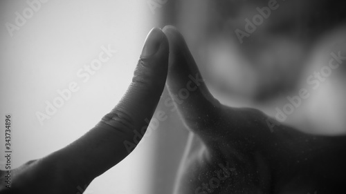 Monochrome finger and mirror reflection social distancing concept
