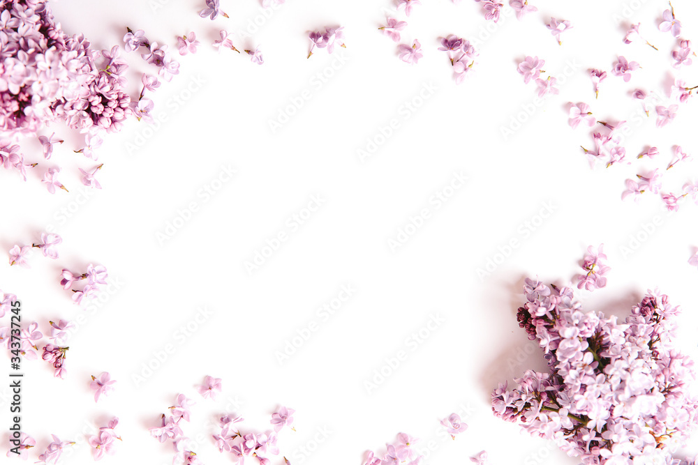 Frame of lilac flowers with space for text on white background. Flat lay, top view Frame of lilac flowers with space for text on white background. Flat lay, top view