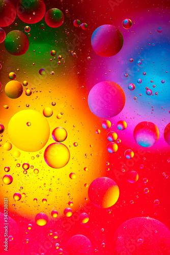 Abstract colorful background from luminous circles of water planets  vertical