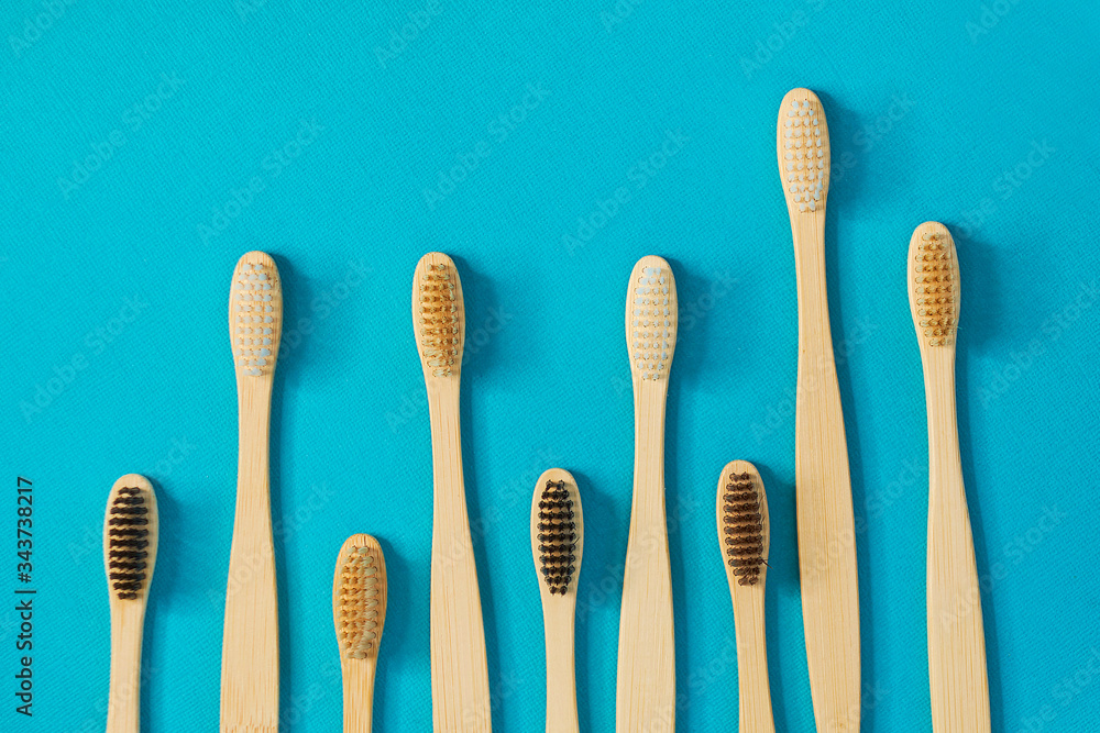 Wooden toothbrushes on a blue background. zero waste concept. dental care without platysik. Wooden toothbrushes on a blue background. zero waste concept. dental care without platysik.