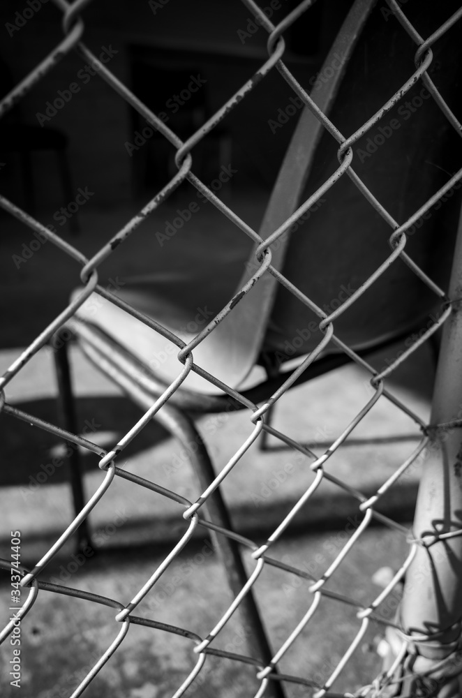 Chair behind fence Chair behind fence