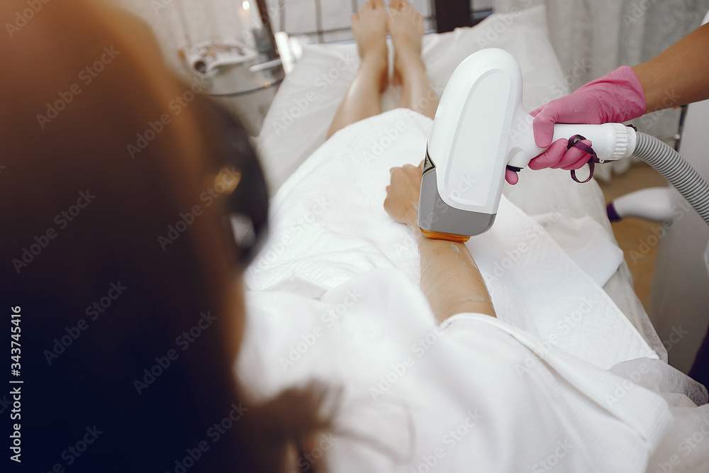 Cosmetologist use laser. Woman with cosmetologist. Lady in a beauty studio. Cosmetologist use laser. Woman with cosmetologist. Lady in a beauty studio.
