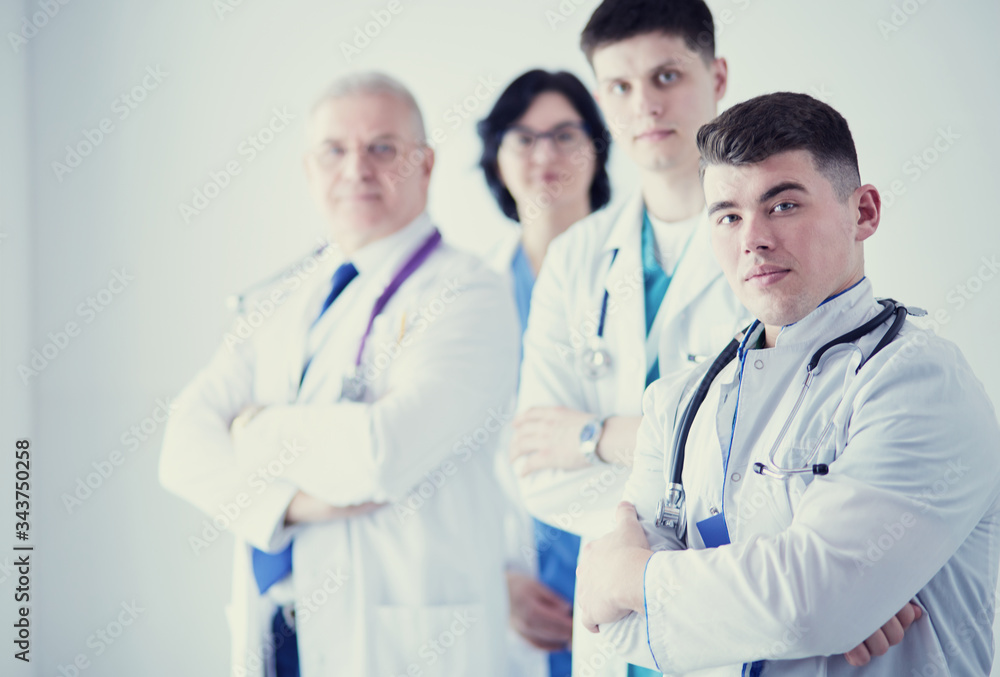 Successful medical team. Confident doctors team standing together and smiling Successful medical team. Confident doctors team standing together and smiling