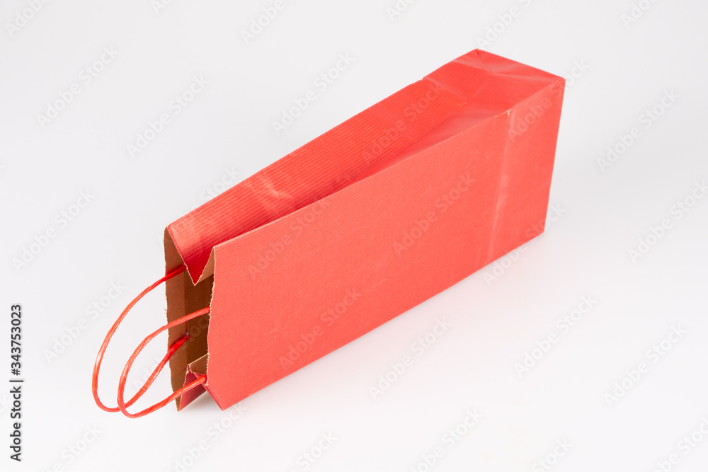 Orange red shopping gift bootle bag isolated on white background Orange red shopping gift bootle bag isolated on white background