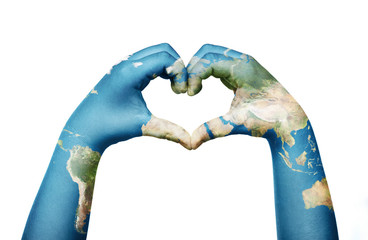 Close up of child hands, painted in the world map, formig heart shape isolated on white background
