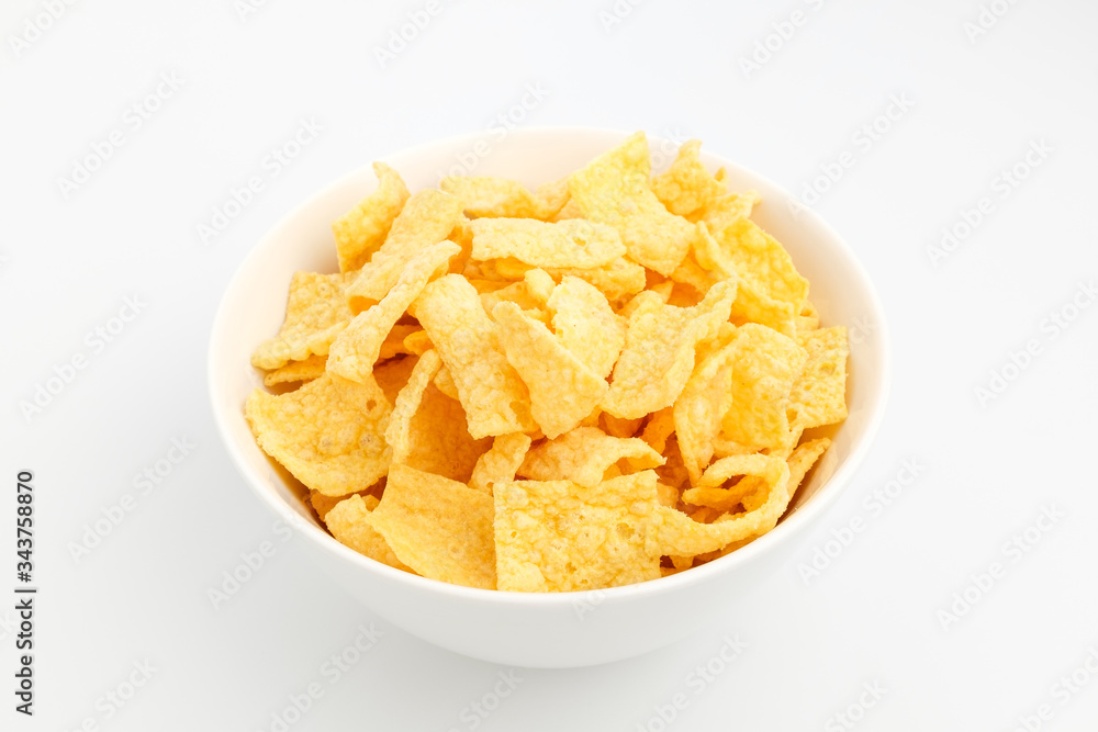 Chips made of corn on a white background