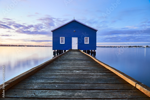 Rustic blue house on the water