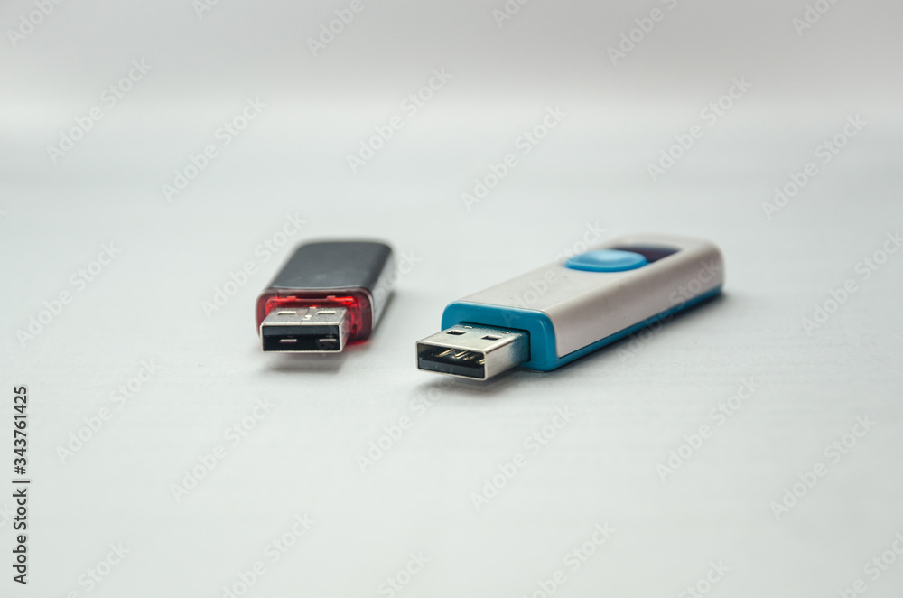 Two different flash drives lying nearby. Two different flash drives lying nearby.