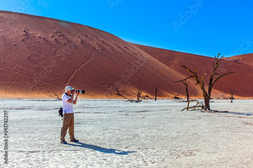 Tourist with a photo bag photo