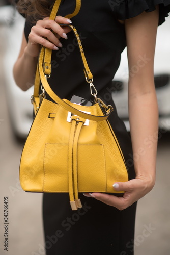 Summer bag Italian style in the hands of a woman 