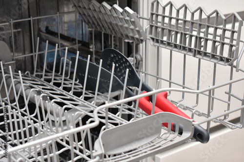 Open dishwasher with dishes inside