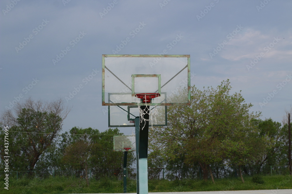 Basketball hoop with clouds on the background in a sports complex in Poseidonio, Thessaloniki Greece Basketball hoop with clouds on the background in a sports complex in Poseidonio, Thessaloniki Greece