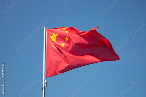 Flag of People's Republic of China isolated waving on the wind isolated