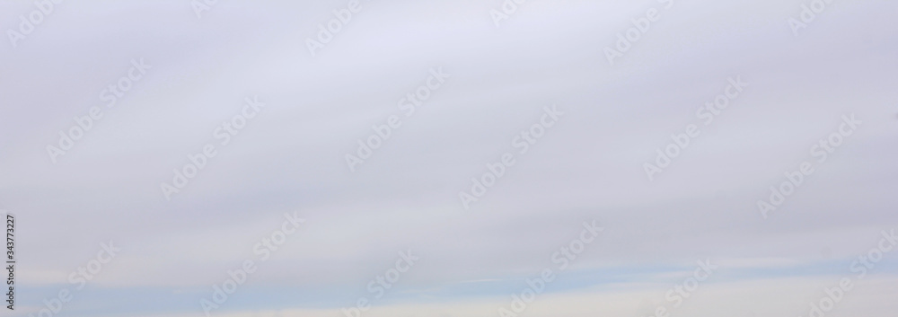 Cloudy sky nature background. Stormy clouds skyscape view concept. White puffy clouds on the sky, clouded horizon wallpaper on gloomy day 