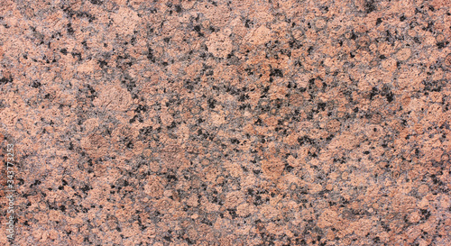 Granite rock texture background close up view. Grey black and pale pink mineral marbel stone surface. Natural granite material stone background with blank copy space. Abstract empty seamless backdrop