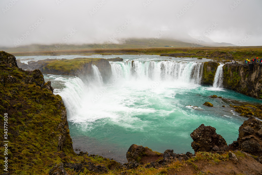 The Godafoss Icelandic: Goðafoss waterfall of the gods, is a famous waterfall in Iceland. The Godafoss Icelandic: Goðafoss waterfall of the gods, is a famous waterfall in Iceland.