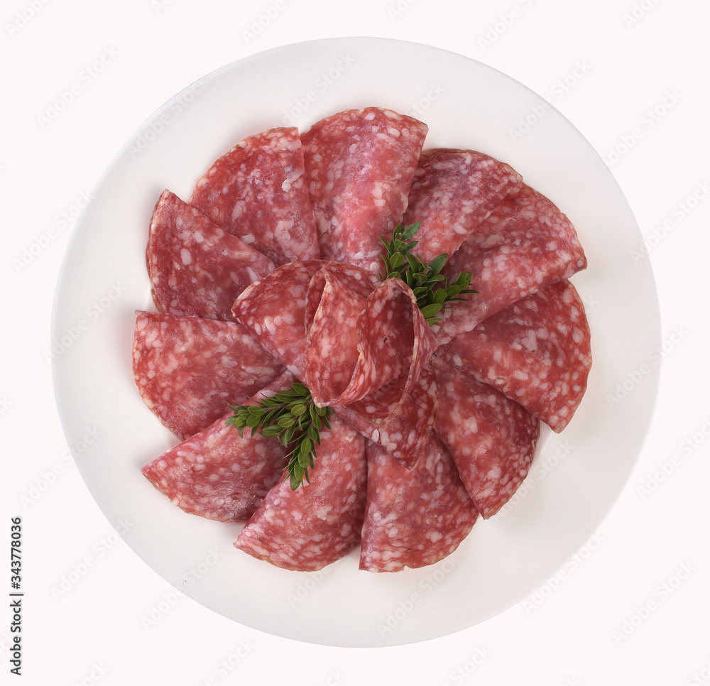 Sliced and dished salami, isolated on white background, top view Sliced and dished salami, isolated on white background, top view