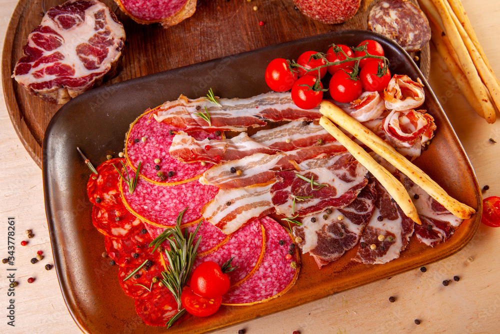 meat dish on a plate with vegetables and spices meat dish on a plate with vegetables and spices