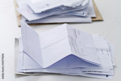 A stack of professional or invoice letters