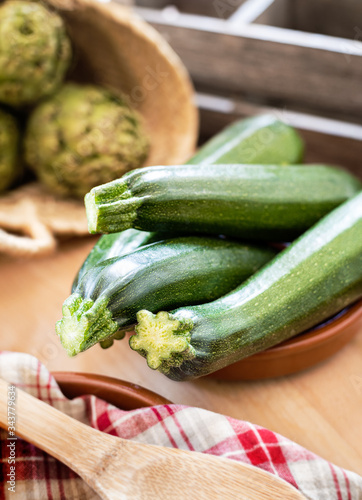 Zucchini still life on rustic wooden background