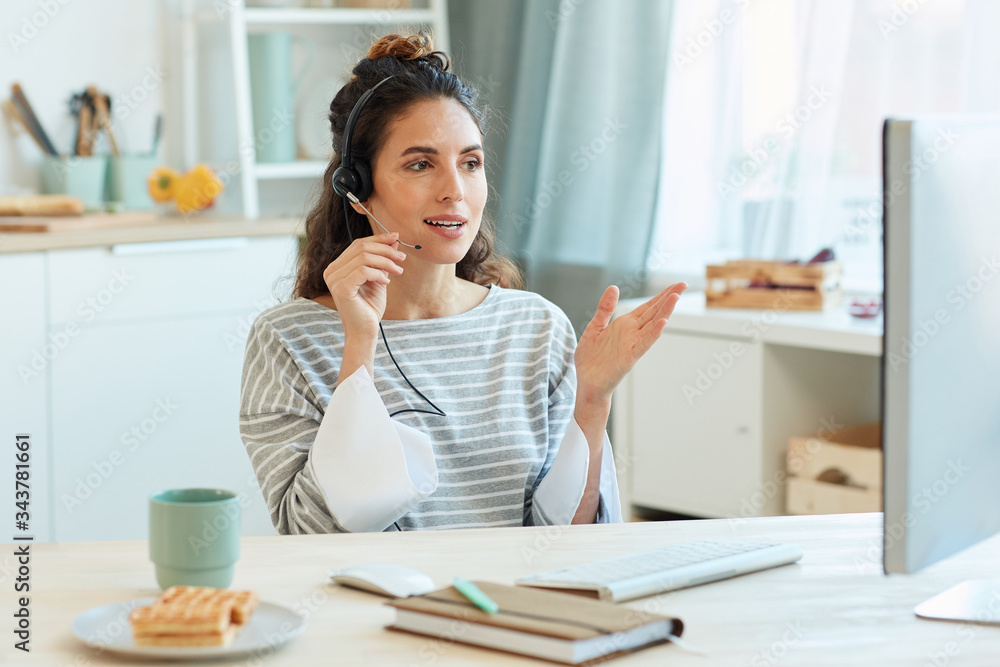 Modern businesswoman spending morning at home talking with her colleagues using video conference app Modern businesswoman spending morning at home talking with her colleagues using video conference app