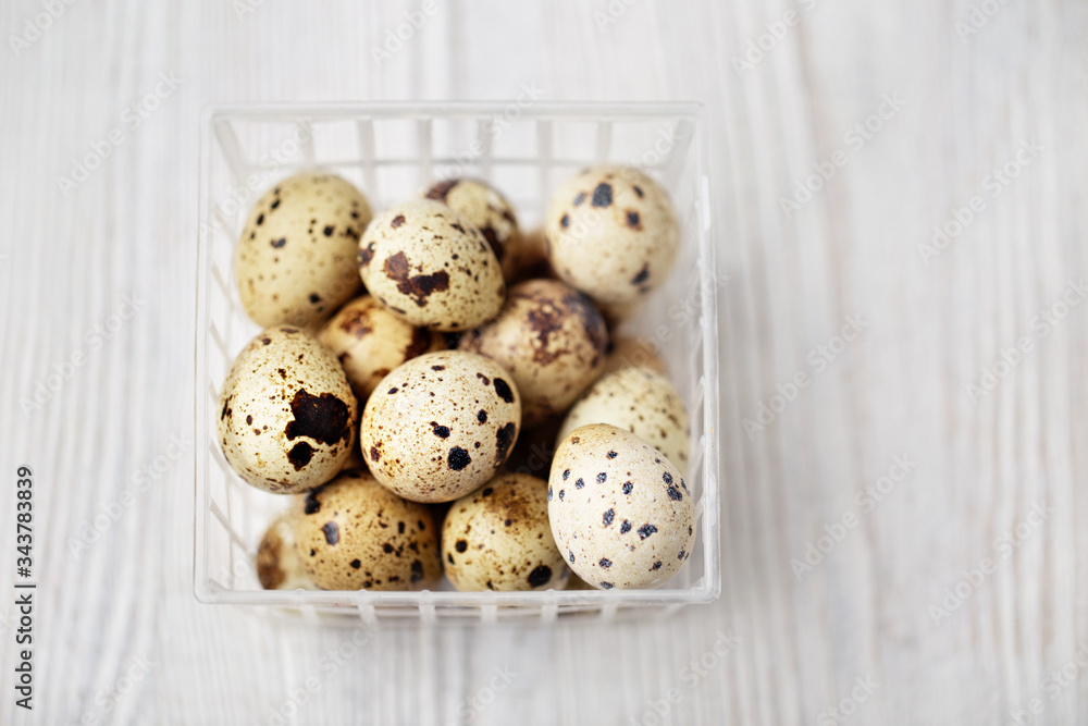 Quail eggs in plastic box. Organic food. Selective focus Quail eggs in plastic box. Organic food. Selective focus
