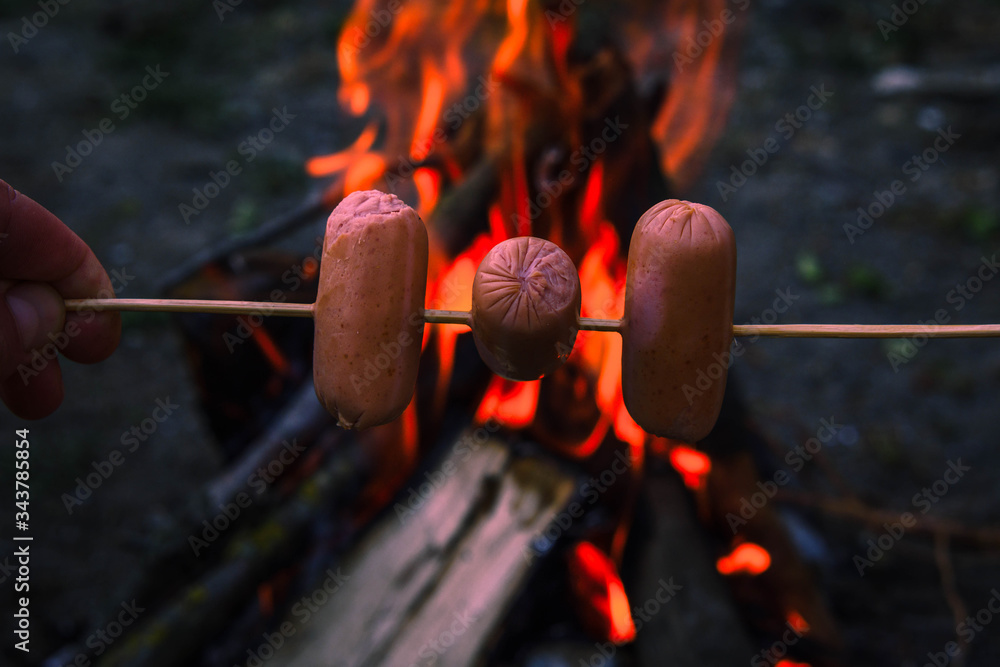 Grilled sausages on fire. Grilled sausages. Grilled sausages on fire. Grilled sausages.