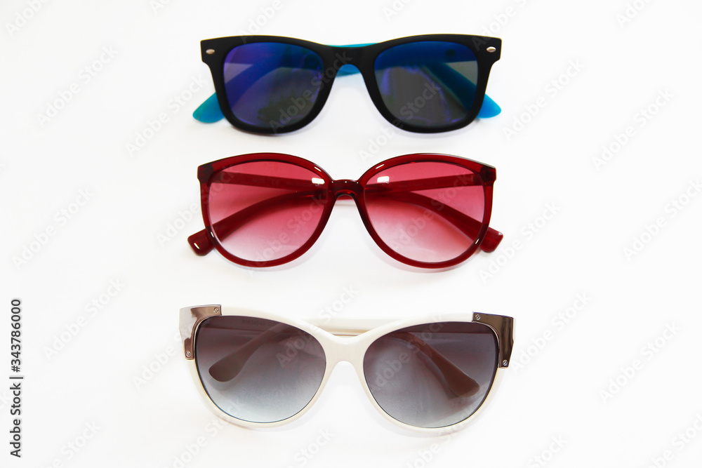 sunglasses with multi-colored lenses and frames on a white background sunglasses with multi-colored lenses and frames on a white background