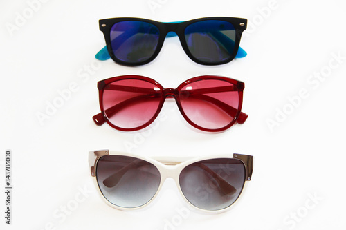 sunglasses with multi-colored lenses and frames on a white background