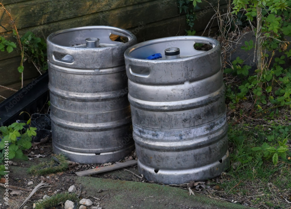 A close up of two silver metal barrels A close up of two silver metal barrels