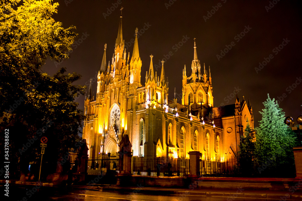 Russia. Walk around Moscow. Gothic cathedral at night lit by lanterns.
