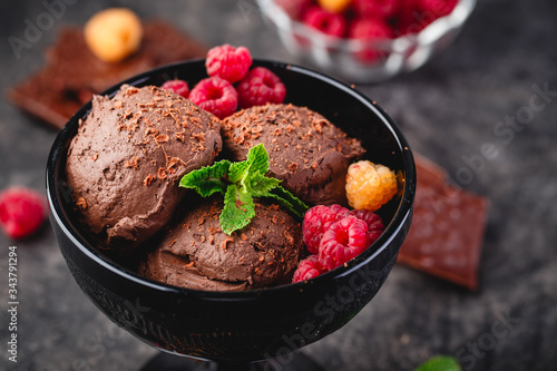 Three brown chocolate ice cream balls