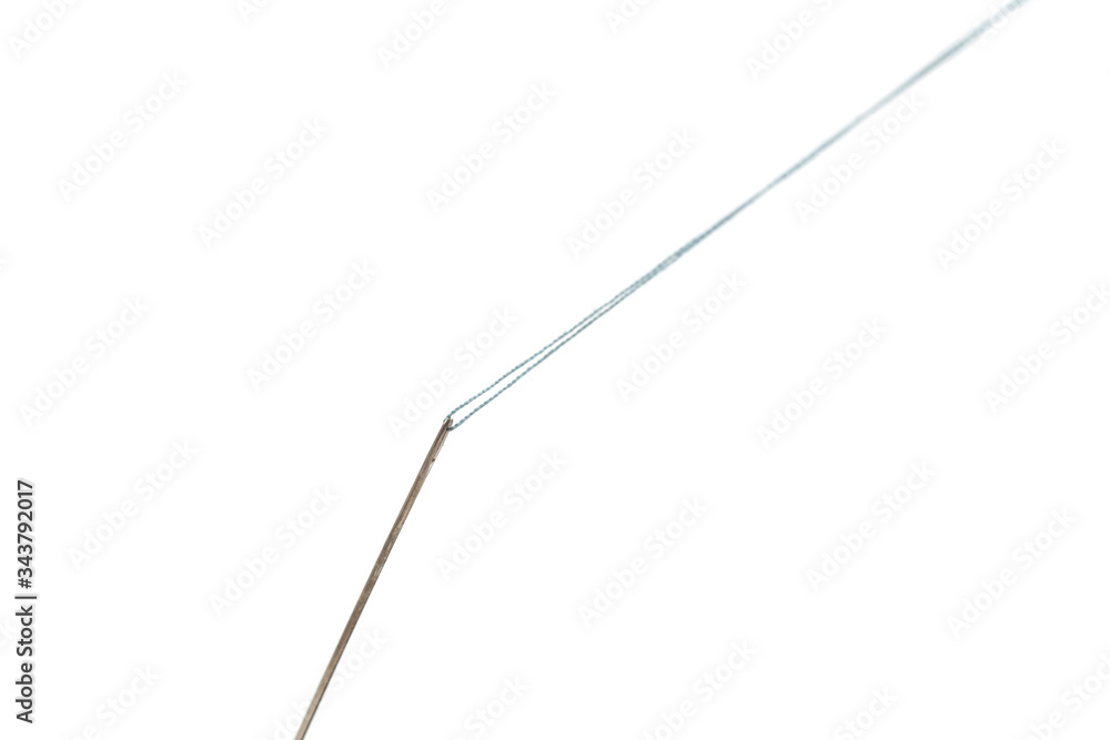 Needle and thread isolated on the white background Needle and thread isolated on the white background