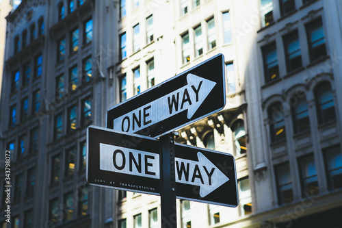 'One way' road signs on the wall of building in New York. © pipil7385