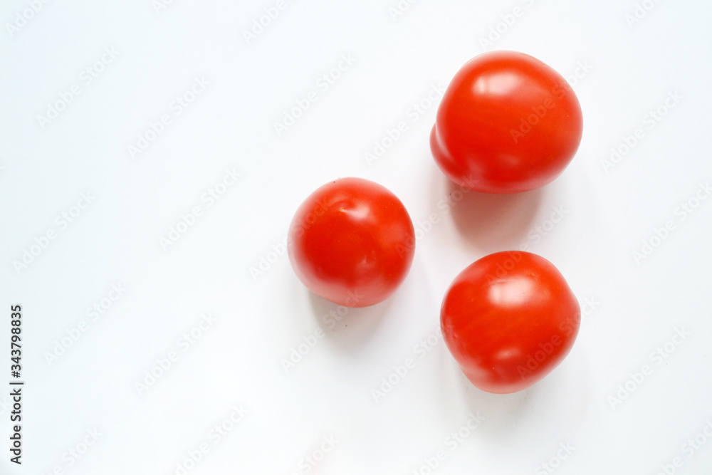 plum tomatoes on a white background plum tomatoes on a white background