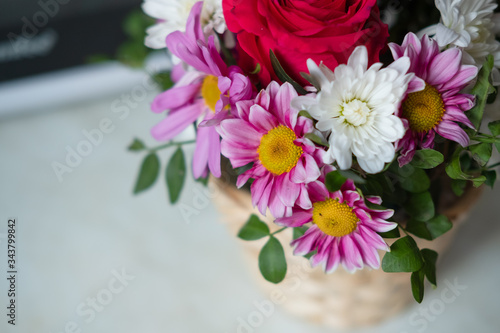 bouquet of gerbera flowers at home in a basket