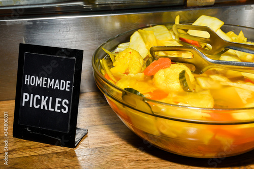 Assorted mix of pickles in sunlight during food festival. photo