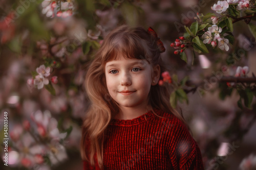 girl in blooming apple tree