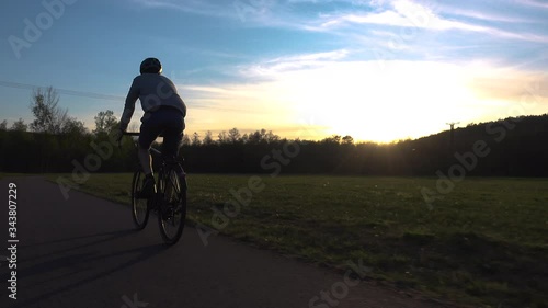 Bike commuter in sunset photo
