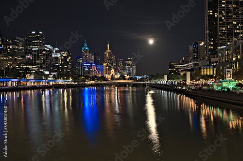 The skyline of Melbourne and the Yarra river during blood moon
